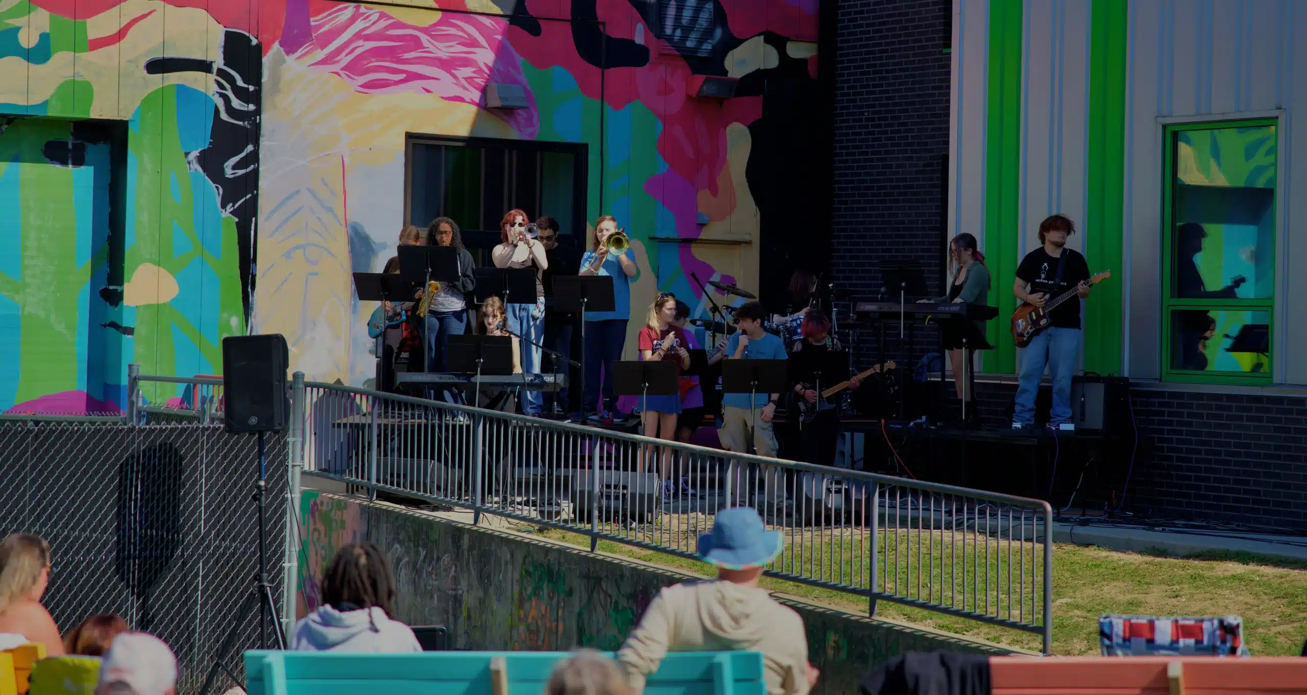 Live band performing in colorful setting.