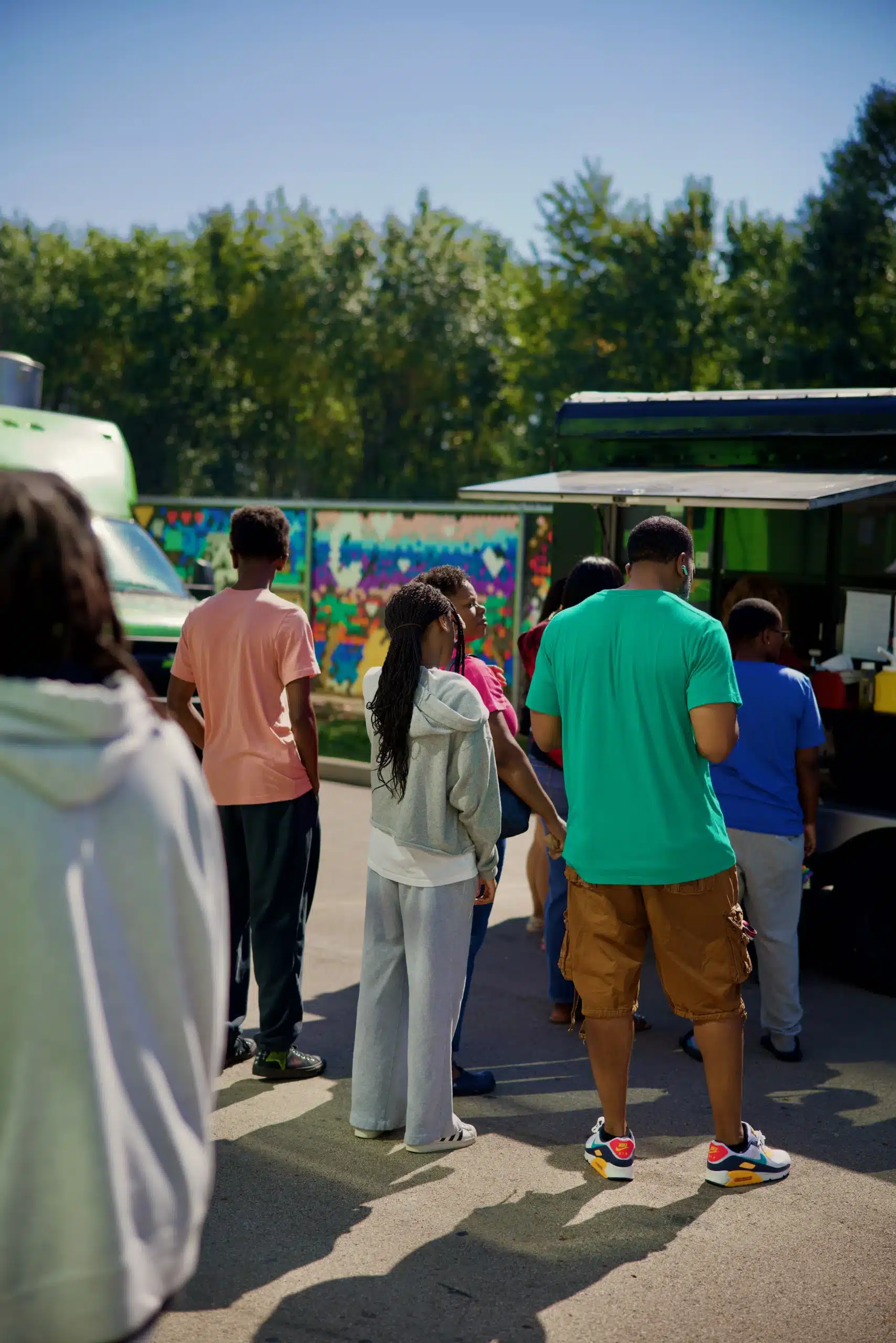 People waiting in line for food.